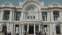 People walking and beautiful Architecture of Museum Bellas Artes in Mexico City	