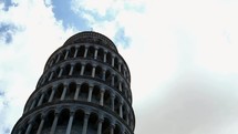 clouds moving over the leaning tower of Pisa 