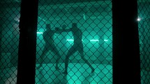 MMA fighters enter the cage ring. Mixed martial arts fight. Cinematic staged fight. 