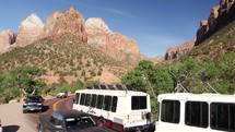 Zion shuttle and traffic on a curve on a road 