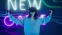Woman moving her arms around playing a virtual reality game.