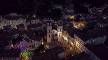 Aerial: St. Tryphon's Cathedral, Kotor, Montenegro bathed in soft night lights