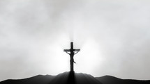Holy Cross silhouette with rays
