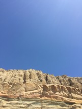 blue sky over cliffs 