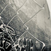 chainlink fence and graffiti 