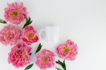 pink flowers and white mug 