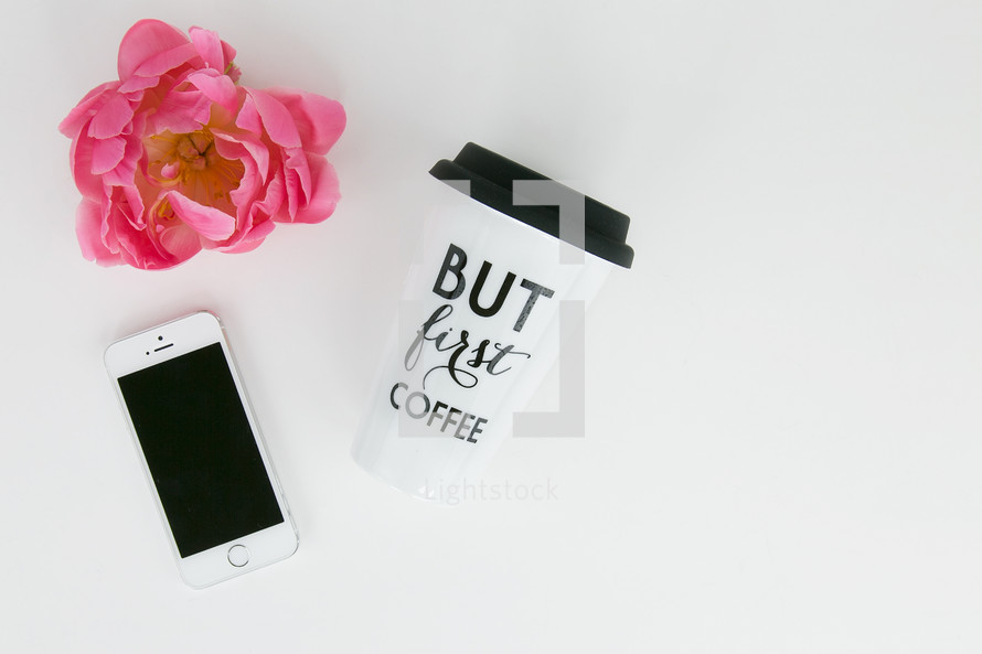 pink flower cellphone and coffee cup