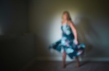 out of focus image of a woman in a floral dress 