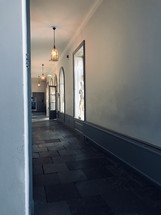 long hallway with a stone floor 