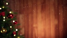 Snowy falling with Christmas tree and wooden background, copy space