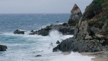 Ocean tempest and dangerous weather near cliff mountains