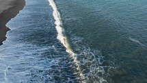 Waves Of Slow Ocean Crashing On The Shoreline, Aerial