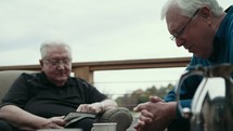 elderly men discussing scripture 