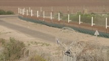 Border fence between Israel and West Bank. barbed wire electronic fence.