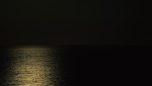 Reflection of the moon on the sea at night