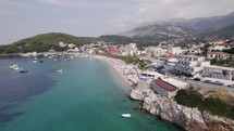 Sfageio Beach Coastline In Himare Beside Turquoise Waters Of The Ionian Sea. Aerial Dolly Forward