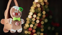 Gingerbread man decoration on a Christmas tree 