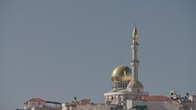 Overview of an Arab city in Israel with a large mosque rising above