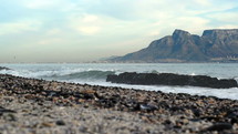 waves crashing into a shore at Table Mountain 