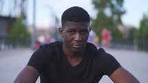 young black male looking at the camera 