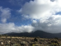 mountain top in the clouds and desert