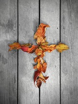 cross made of fall leaves 