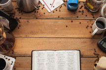 Bible surrounded by coffee shop items 