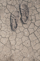 Jesus' shoes on parched soil