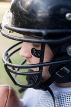 football player wearing a helmet 