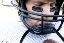 football player in prayer 