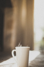 steaming cup of coffee