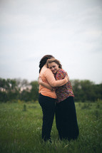 mother and daughter hugging 