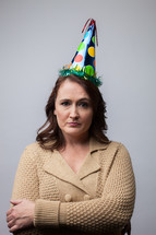 angry woman in a party hat 