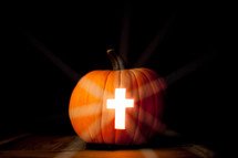 cross carved in a Jack-O-Lantern 