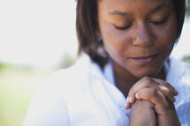 Woman in prayer.