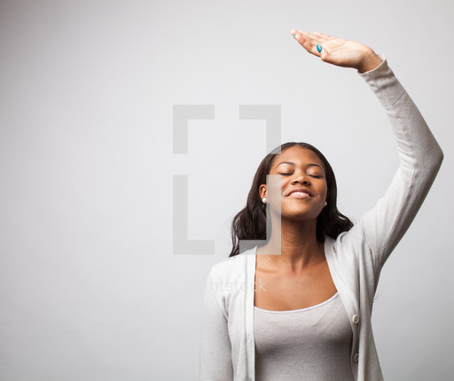 Woman giving praise, raising her arm to the lord. — Photo