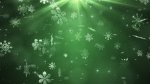Beautiful snowflakes falling on green background. Winter, Christmas, New Years, Holidays background. Seamless looping 4k