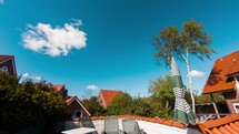 Relaxing sunny day on the terrace with clouds passing on a blue bright sky - timelapse