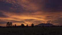 Timelapse of a colorful sunrise over a vast prairie 