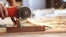 a grinder making sparks 