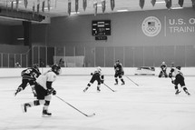 youth hockey game in black and white 