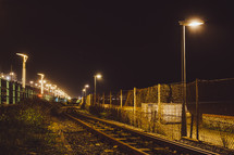 street lamps and train tracks 