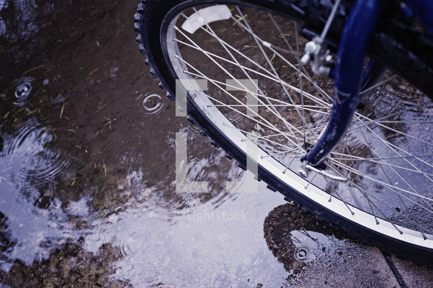 bike tire in a puddle 