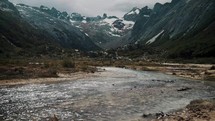 Panorama Of Rocky Mountain Range With River In The Foreground In Ushuaia, Tierra del Fuego, Argentina. - handheld shot