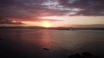 Aerial Pan of View Around Zetland Pier, County Cork At Sunrise, Ireland
