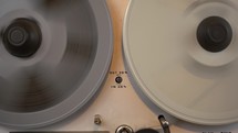 Rewinding a tape on a vintage reel to reel deck