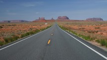 Driving POV through scenic Monument Valley