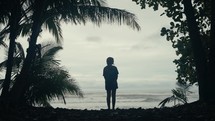 Young woman hiking in a tropical rainforest jungle 