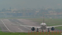 Airplane taking off down a runway