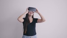 a woman using VR glasses
